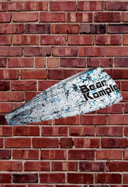 BK JUNK Warped White Headband on brick background showing right side