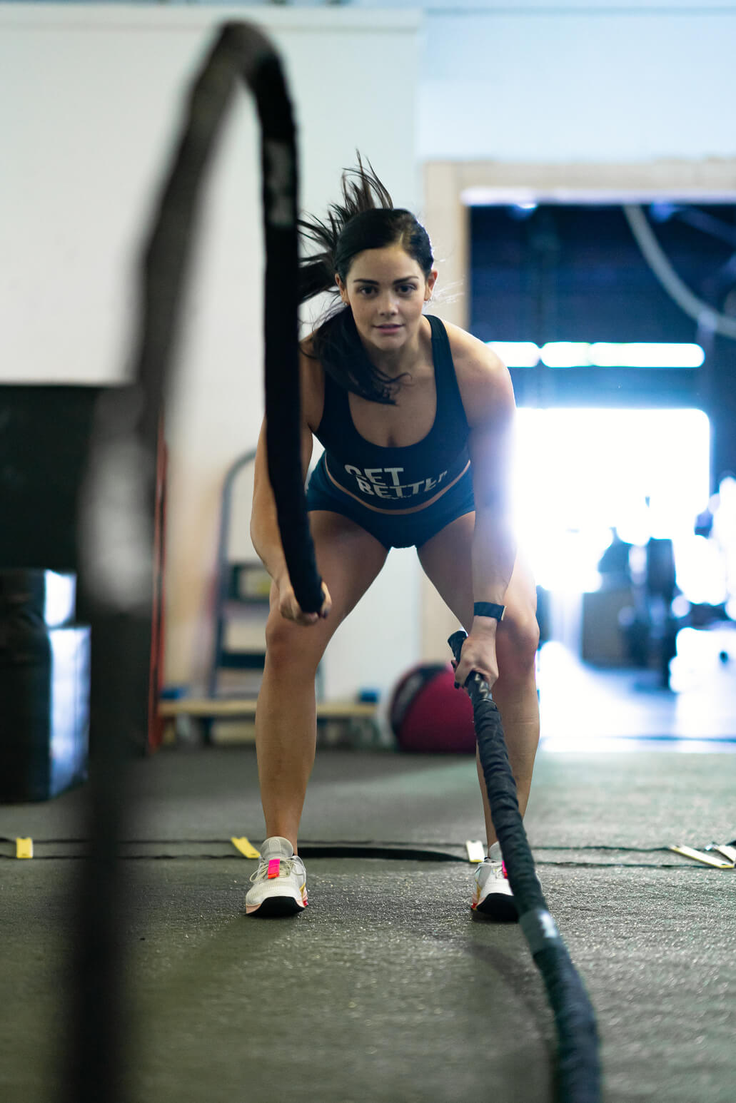 Woman working out using Battle Rope