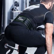 Man squatting and wearing Bear Komplex Lifting Belt