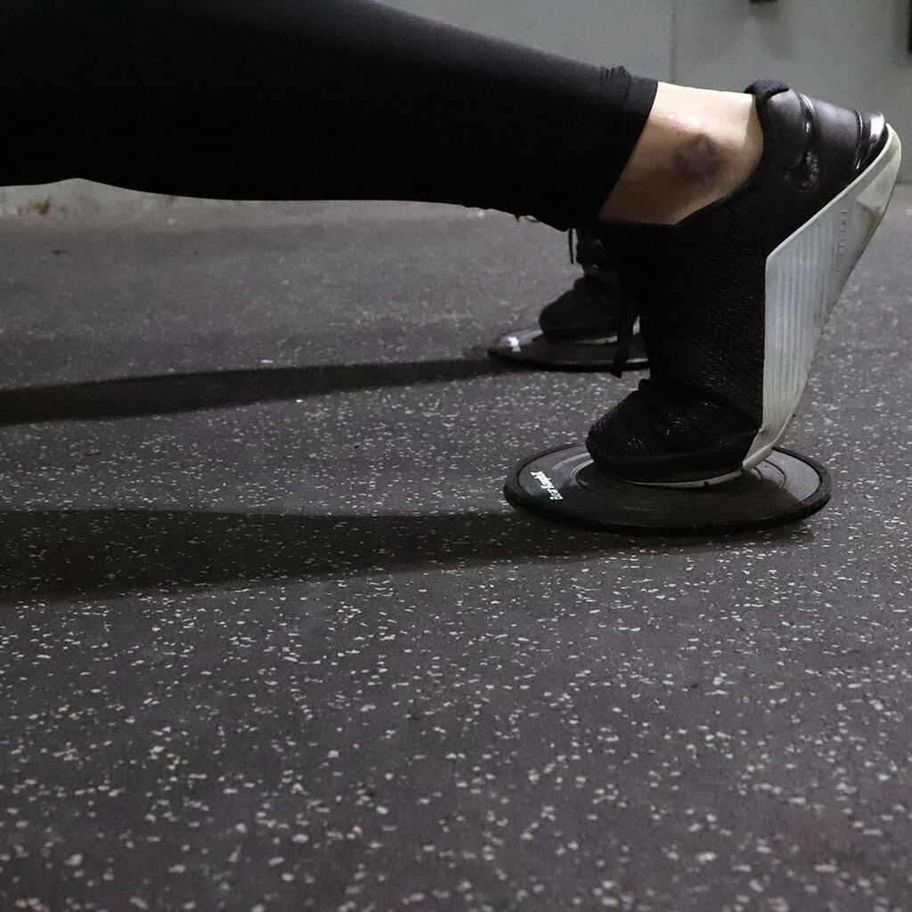 Working out Showing foot on Bear KompleX Core Sliding Discs