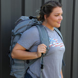Woman wearing Gray military backpack
