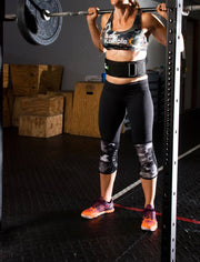 Woman wearing belt while working out