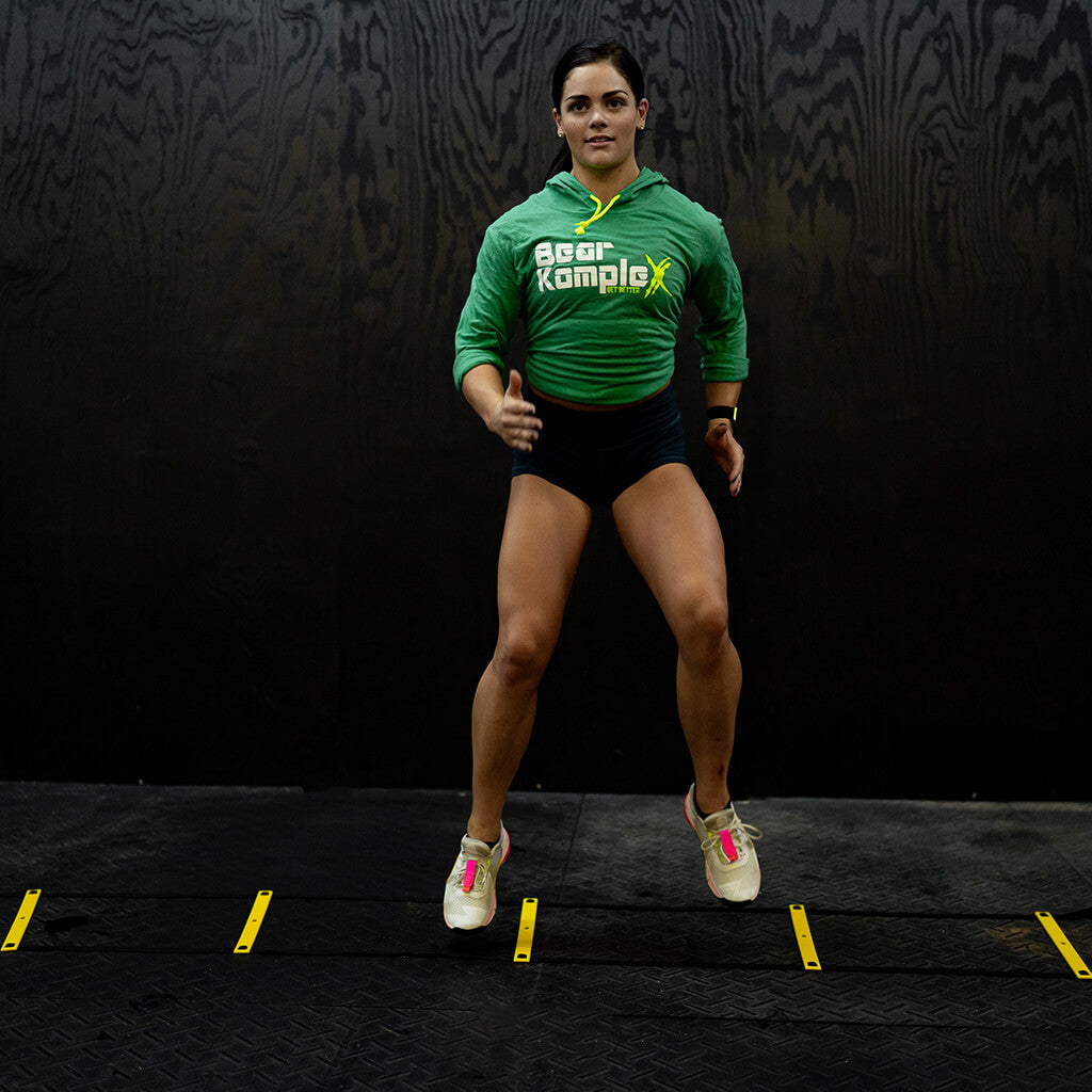woman using BKX Agility Ladder indoors