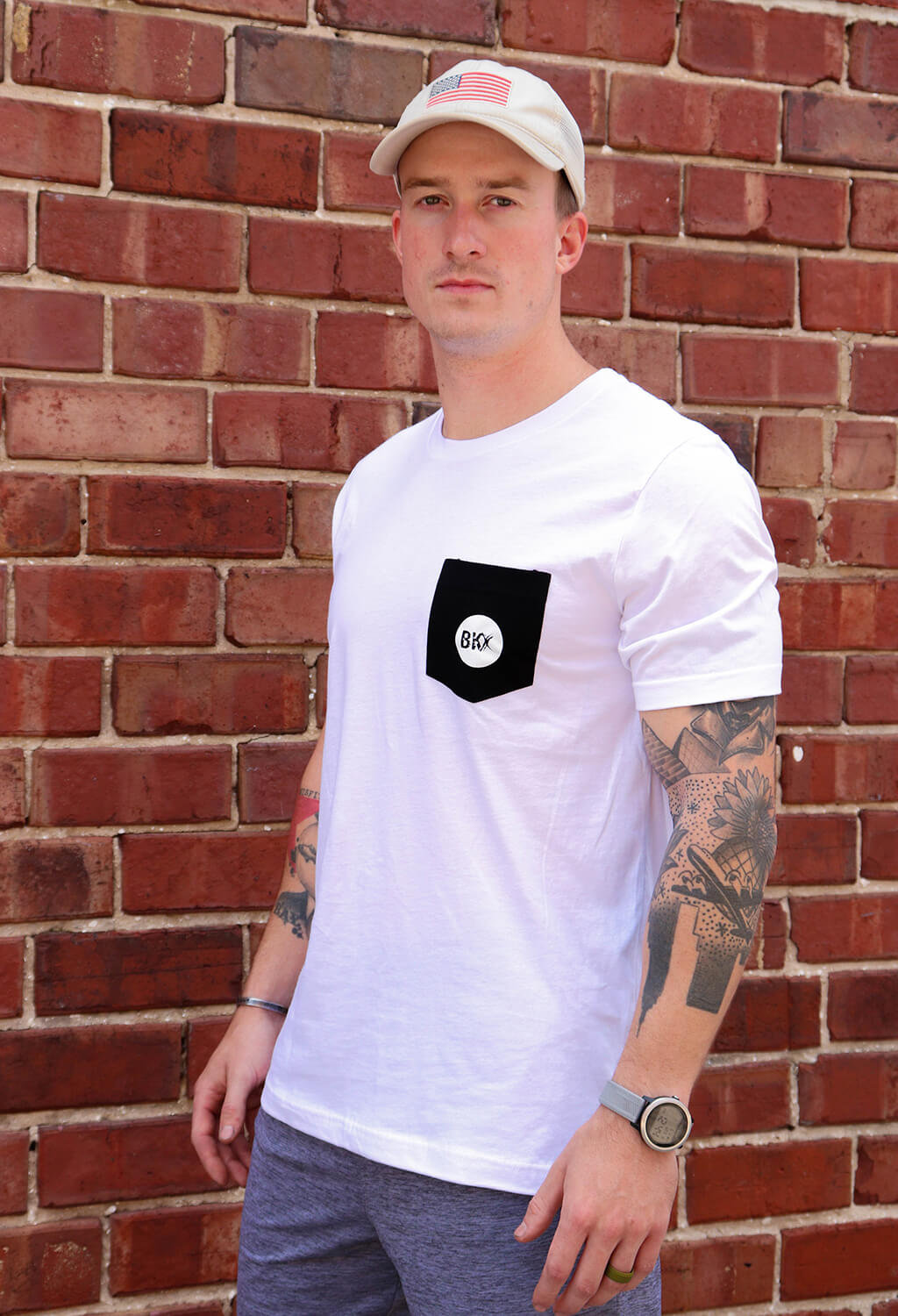Man wearing BKX White Pocket T-Shirt