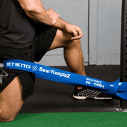 Man working out with Bear KompleX Blue Resistance Heavy Band