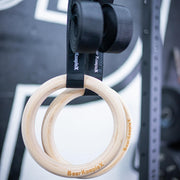 Bear KompleX Gymnastic Wood Rings hanging in gym 