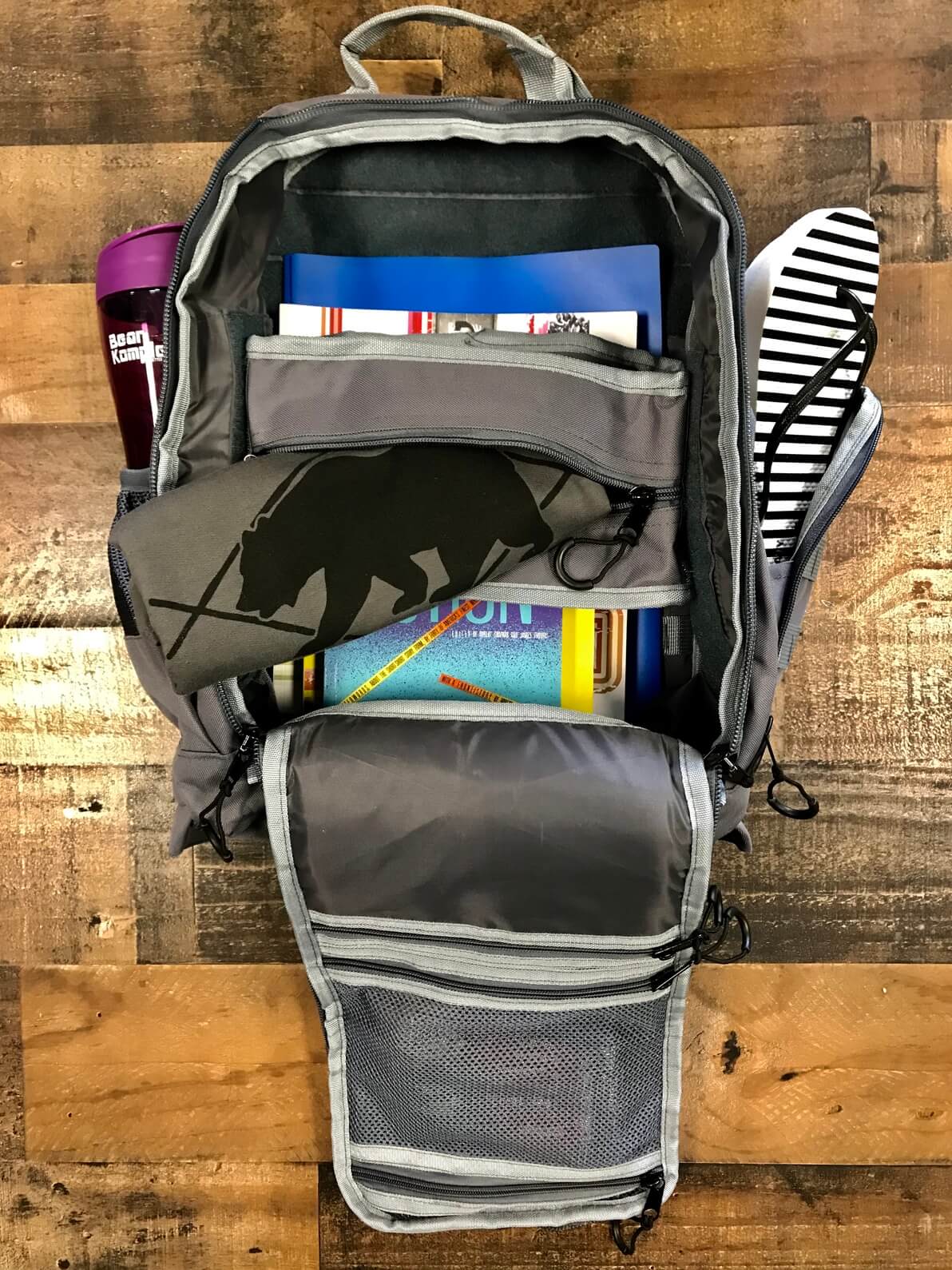 Backpack open showing everything that fits
