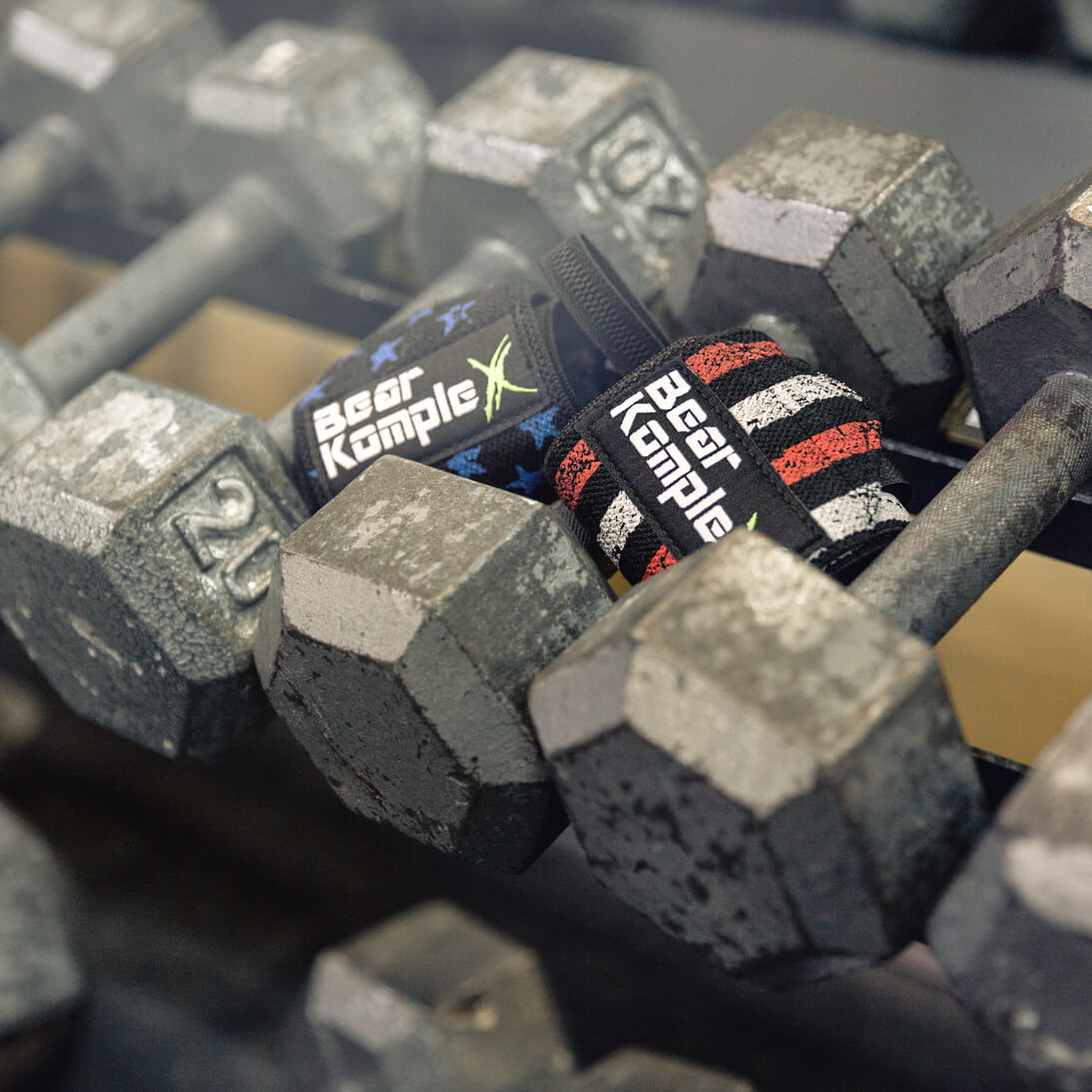 stars and stripes wrist wraps laying on barbells