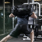 Forward lunges with sandbag on back