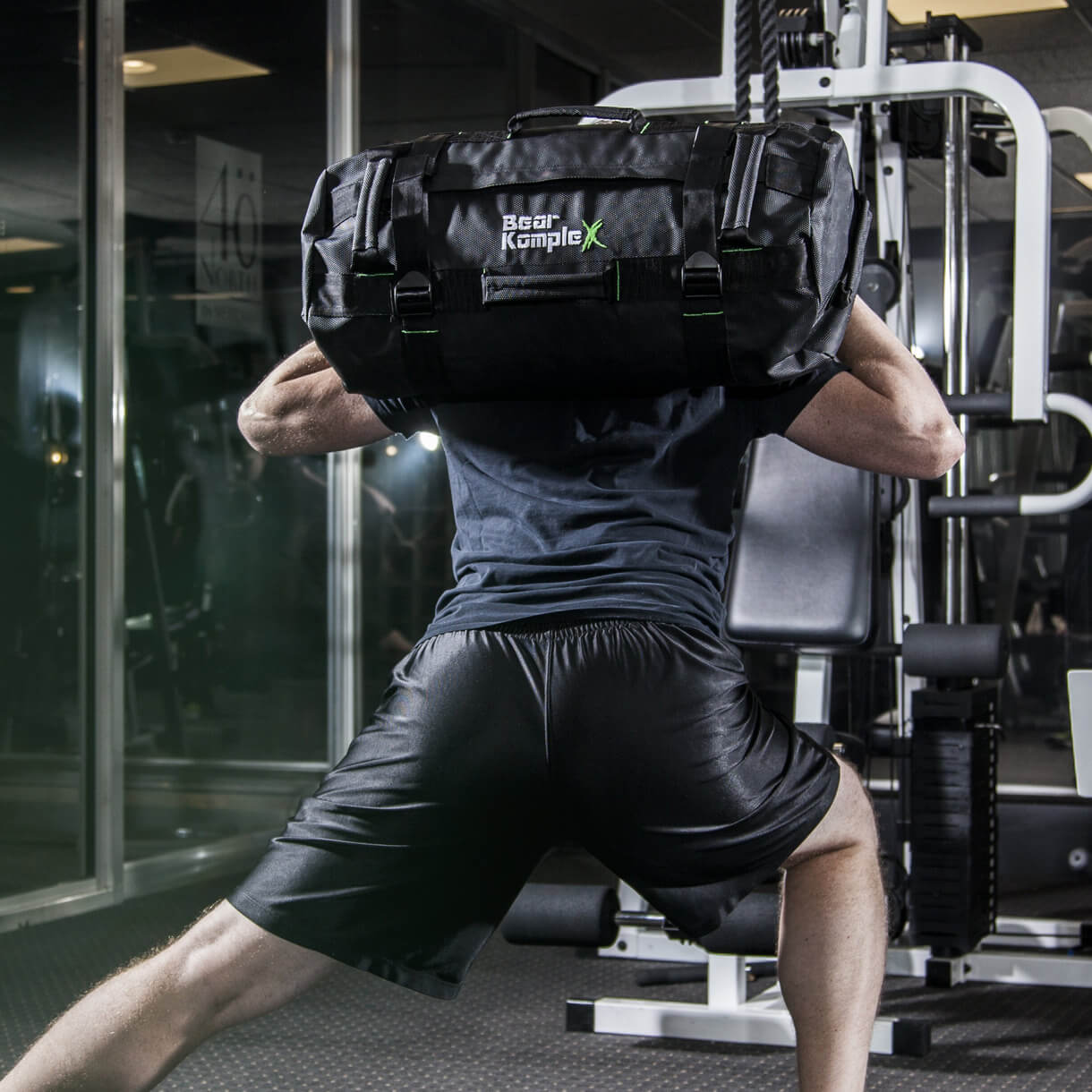 Forward lunges with sandbag on back