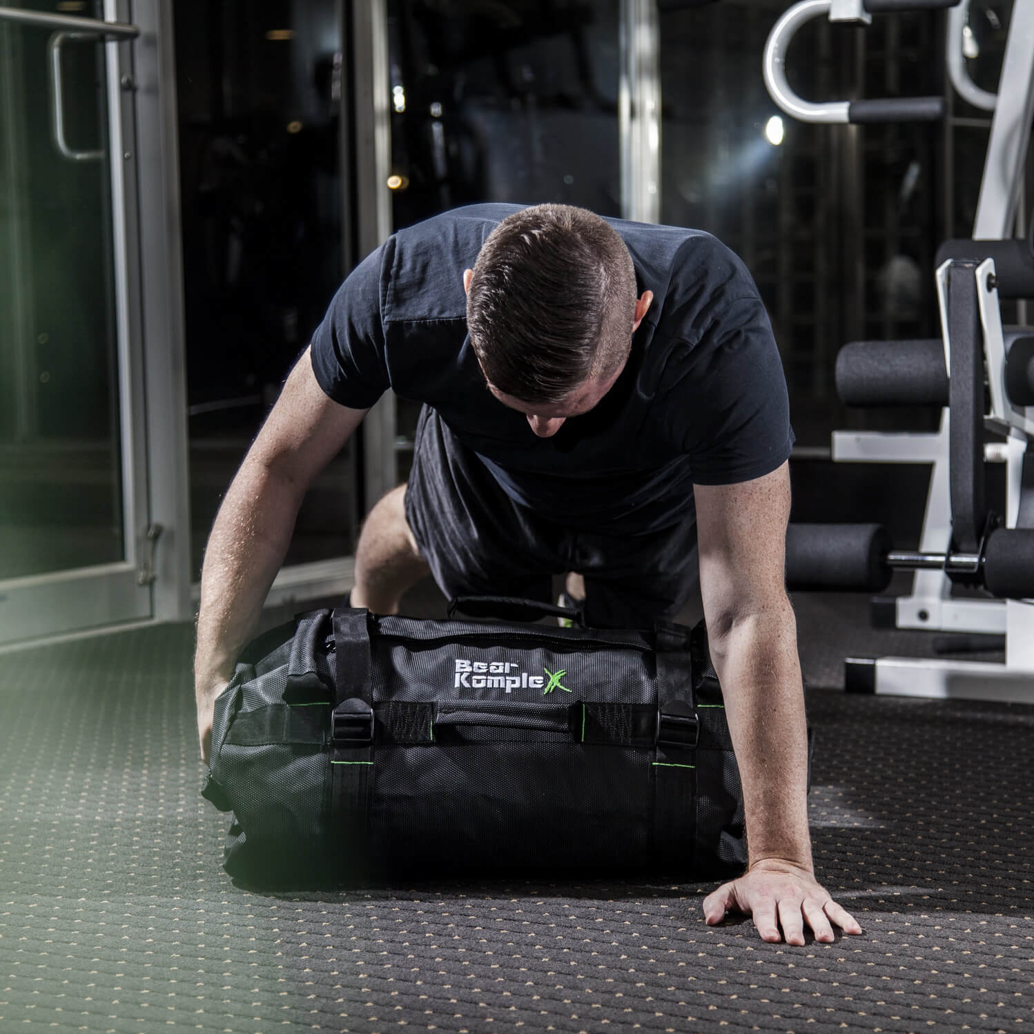 man working out using Bear KompleX Sandbag