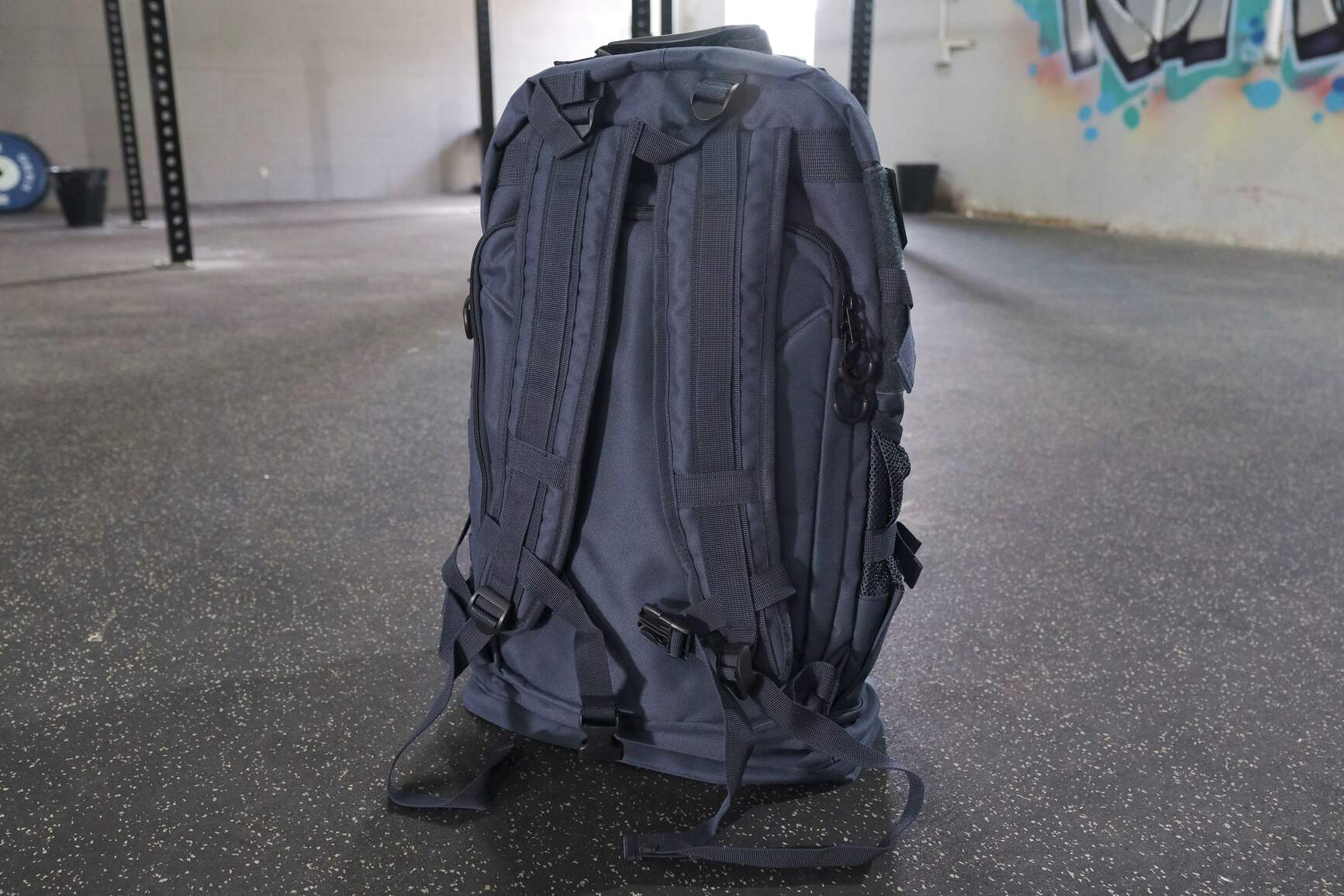 Navy backpack close up showing back view 