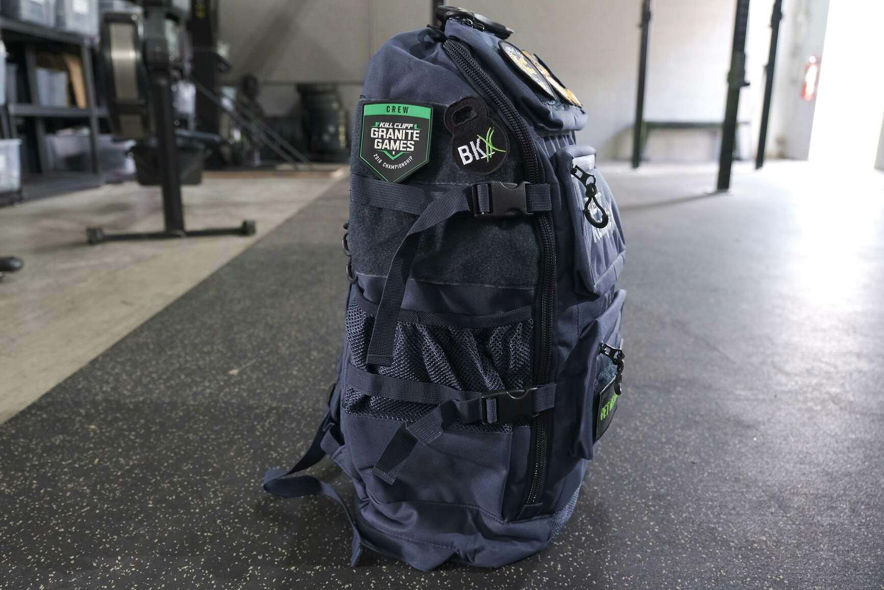 Navy backpack close up showing side view 