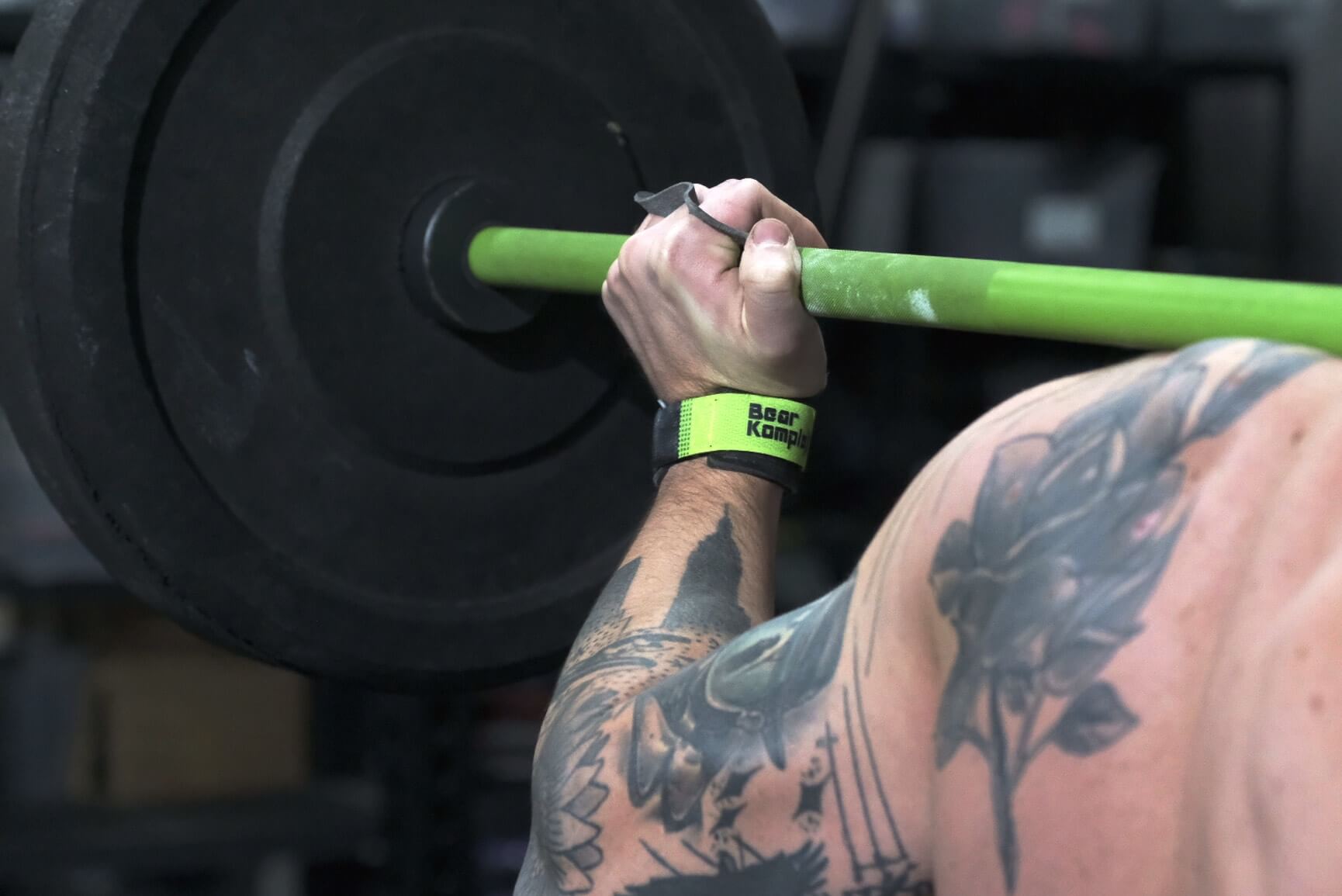 Man lifting showing left hand is Bear KompleX Black Diamond 3 Hole Grips