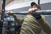 Man doing a pull up using Bear KompleX Black Diamond 3 Hole Grips