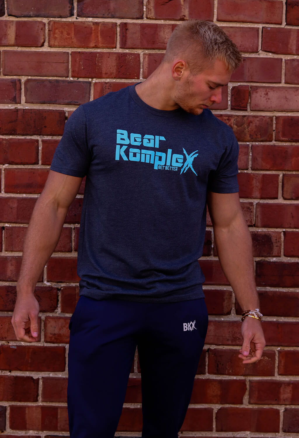 Man wearing Bear KompleX Men's T-Shirt - Blue / Blue Font