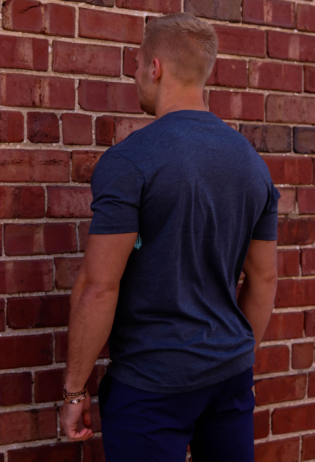 Man wearing Bear KompleX Men's T-Shirt - Blue / Blue Font back view