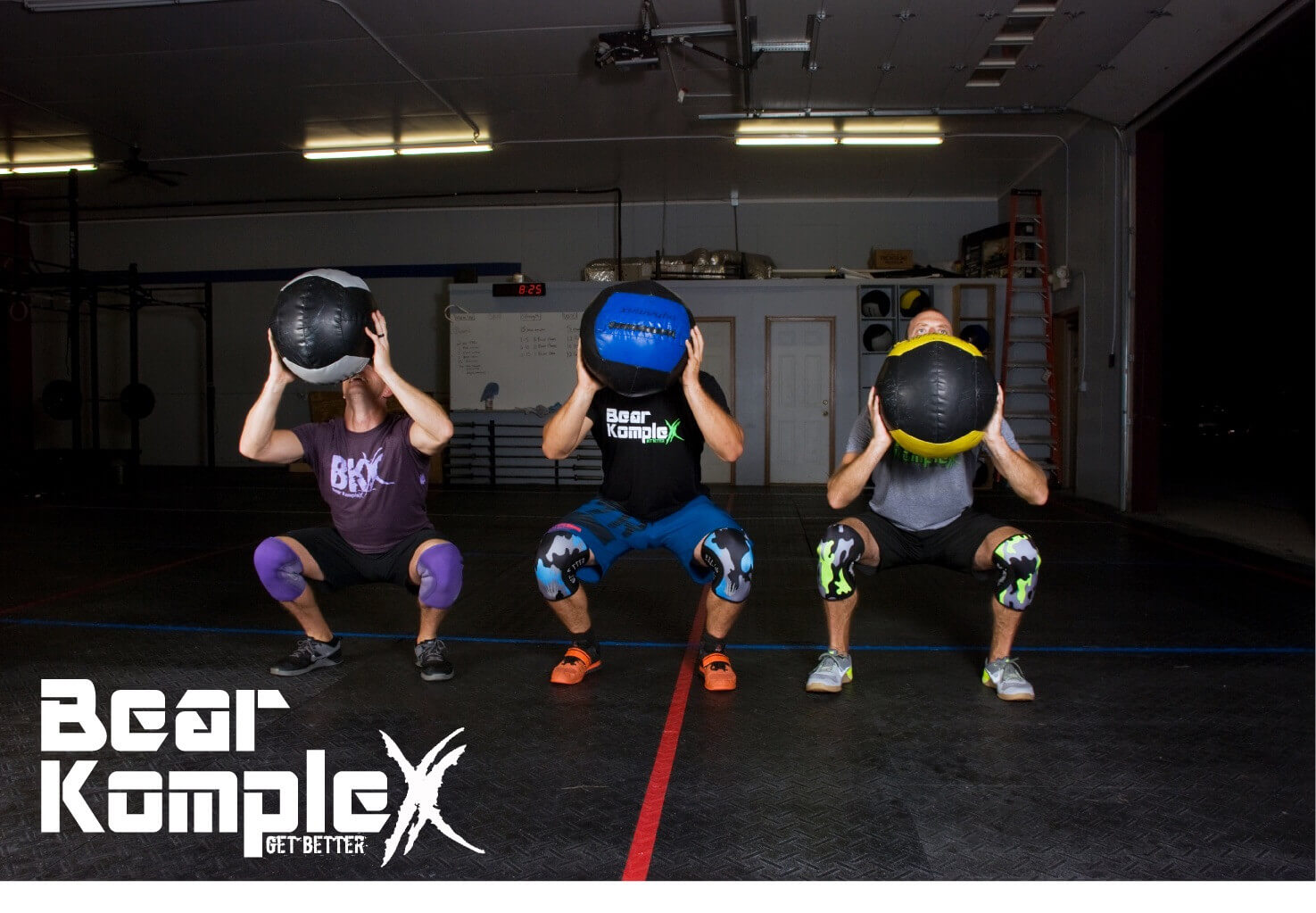 men working out with medicine balls using knee sleeves