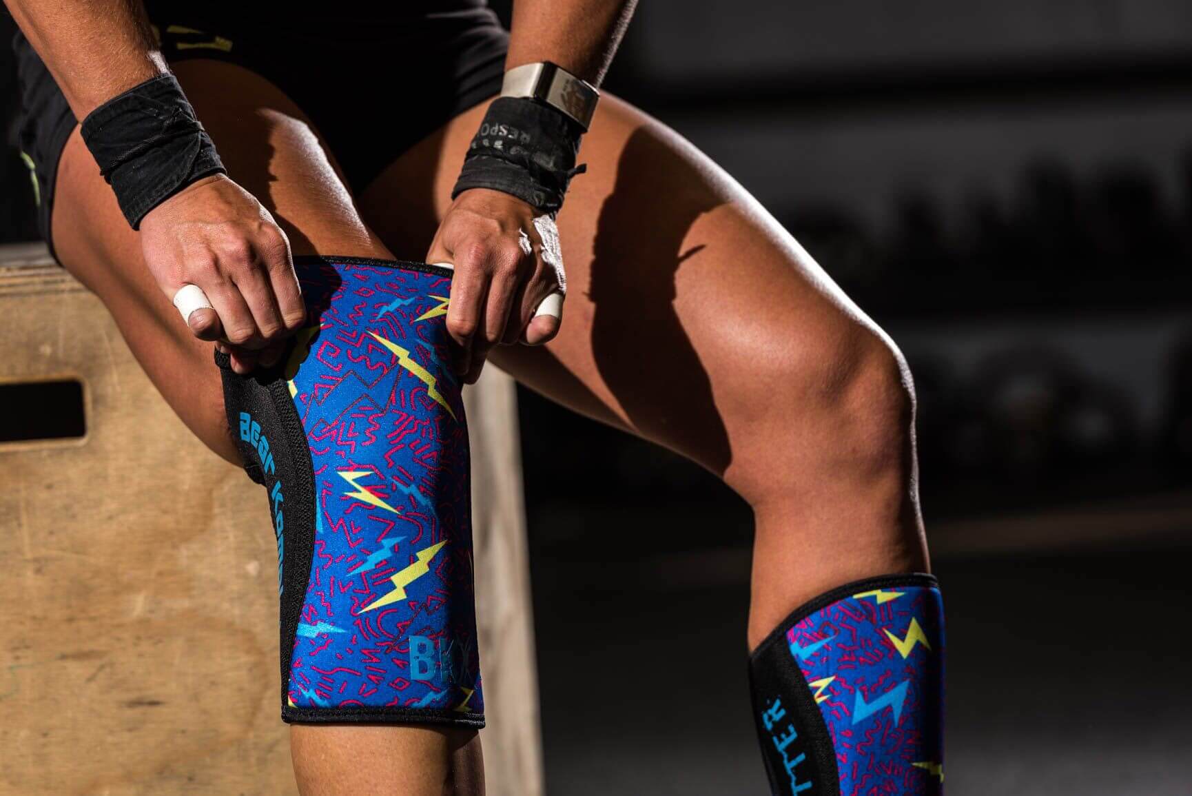 Putting on Bear KompleX Knee Sleeves - Lightning with REVERSIBLE Blue