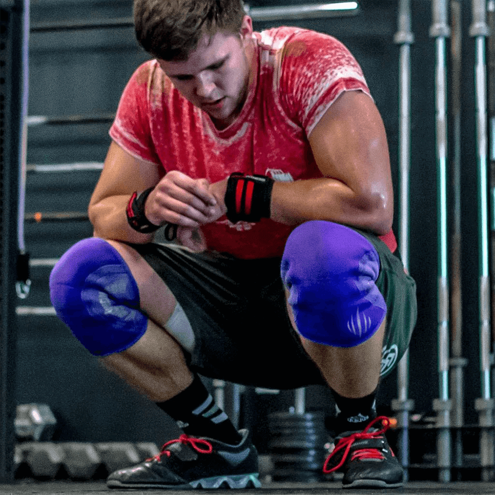 Man resting after workout using knee sleeves