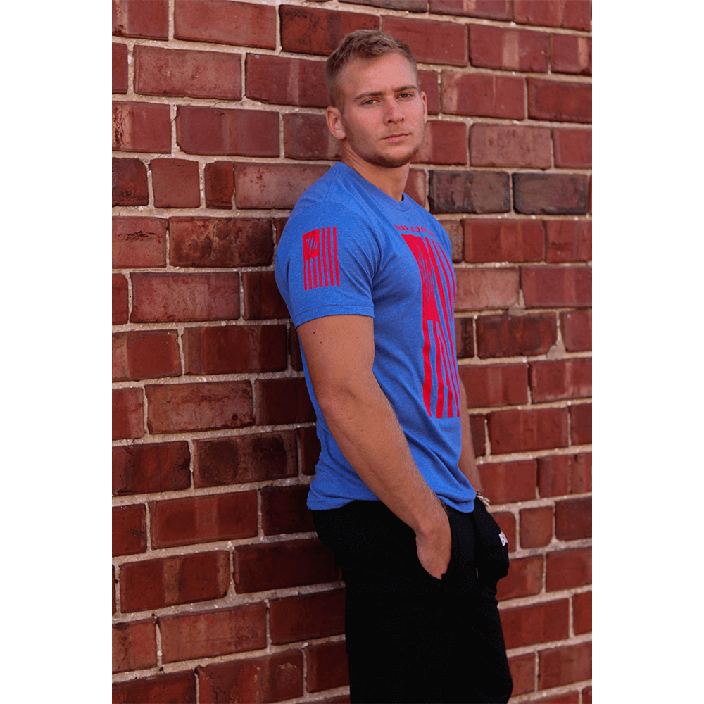 man wearing BKX Patriot Series - Red/Blue leaning on brick wall